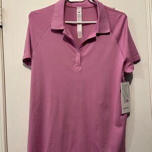 Swiftly Tech Short Sleeve Polo shirt in Dahlia Mauve.  Size 14